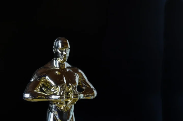 Oscars statue in black background