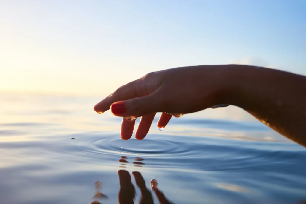 hand touching the water